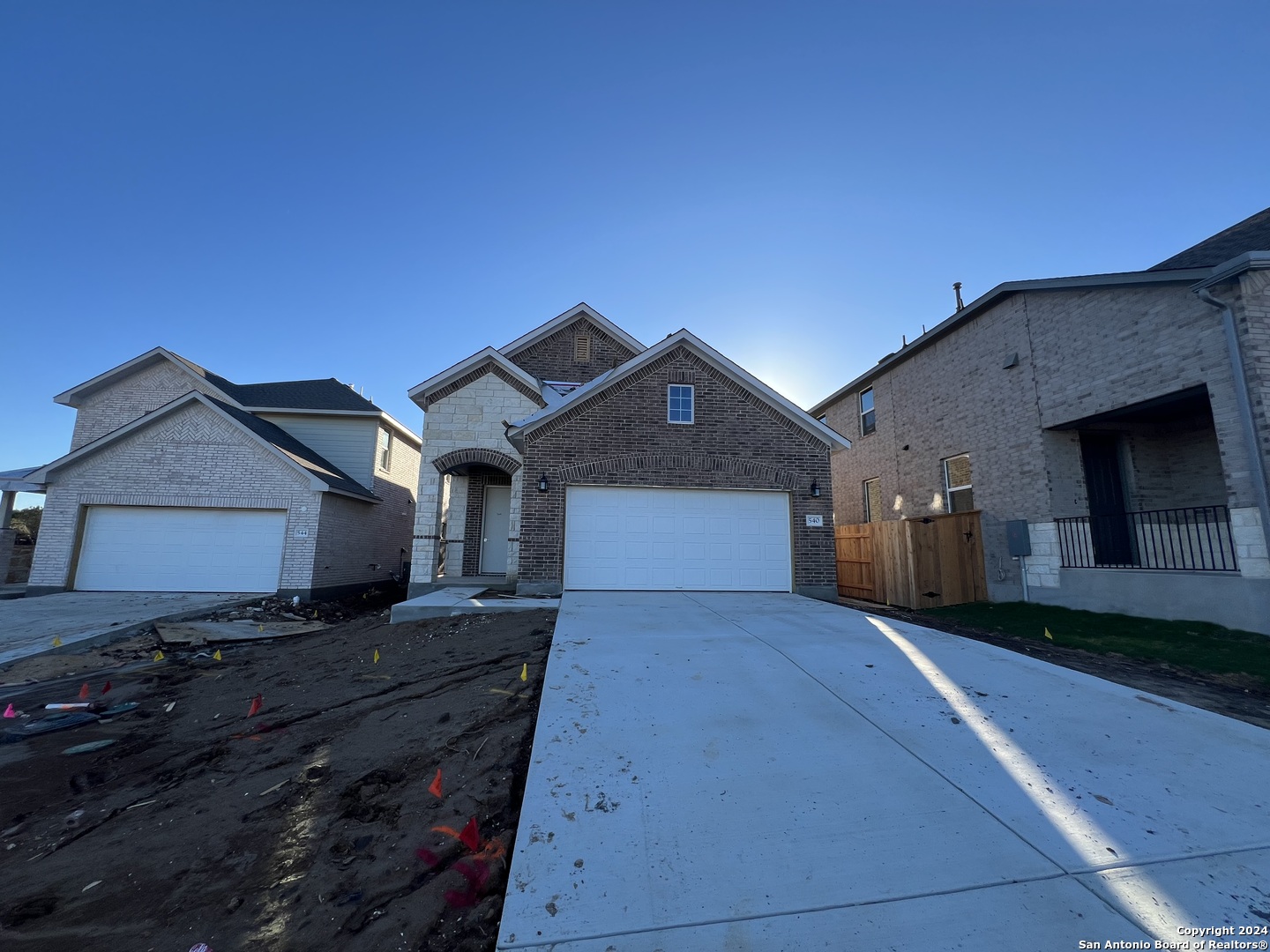 a front view of a house with yard