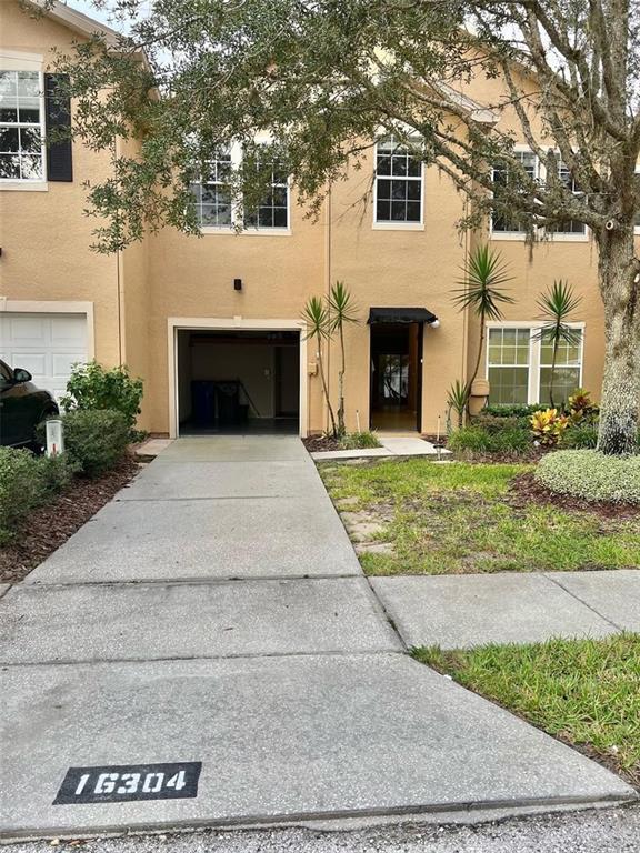 a front view of a house with yard