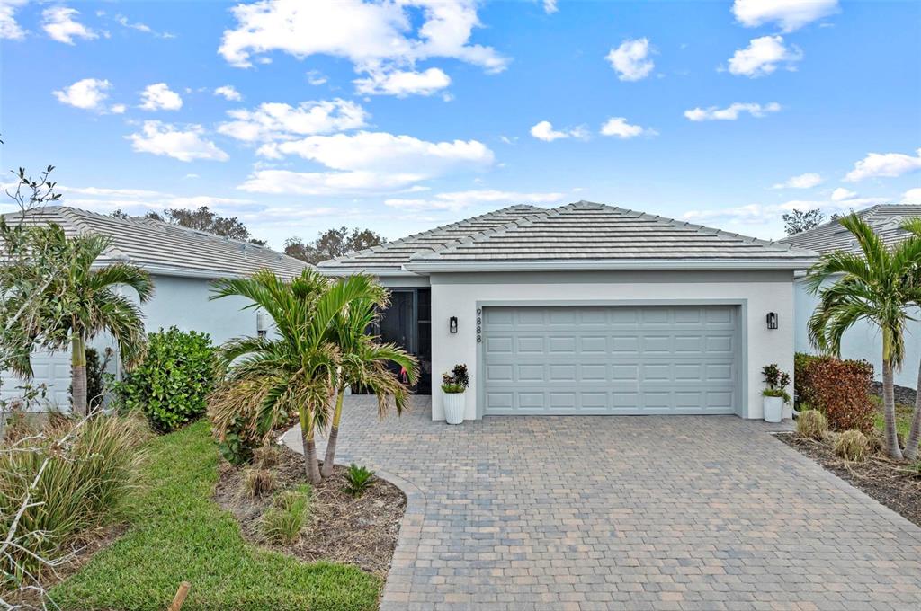 a front view of a house with a garage