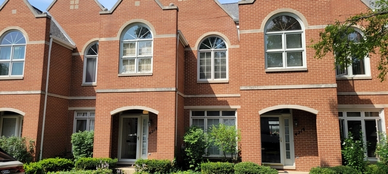 a front view of a house with large windows