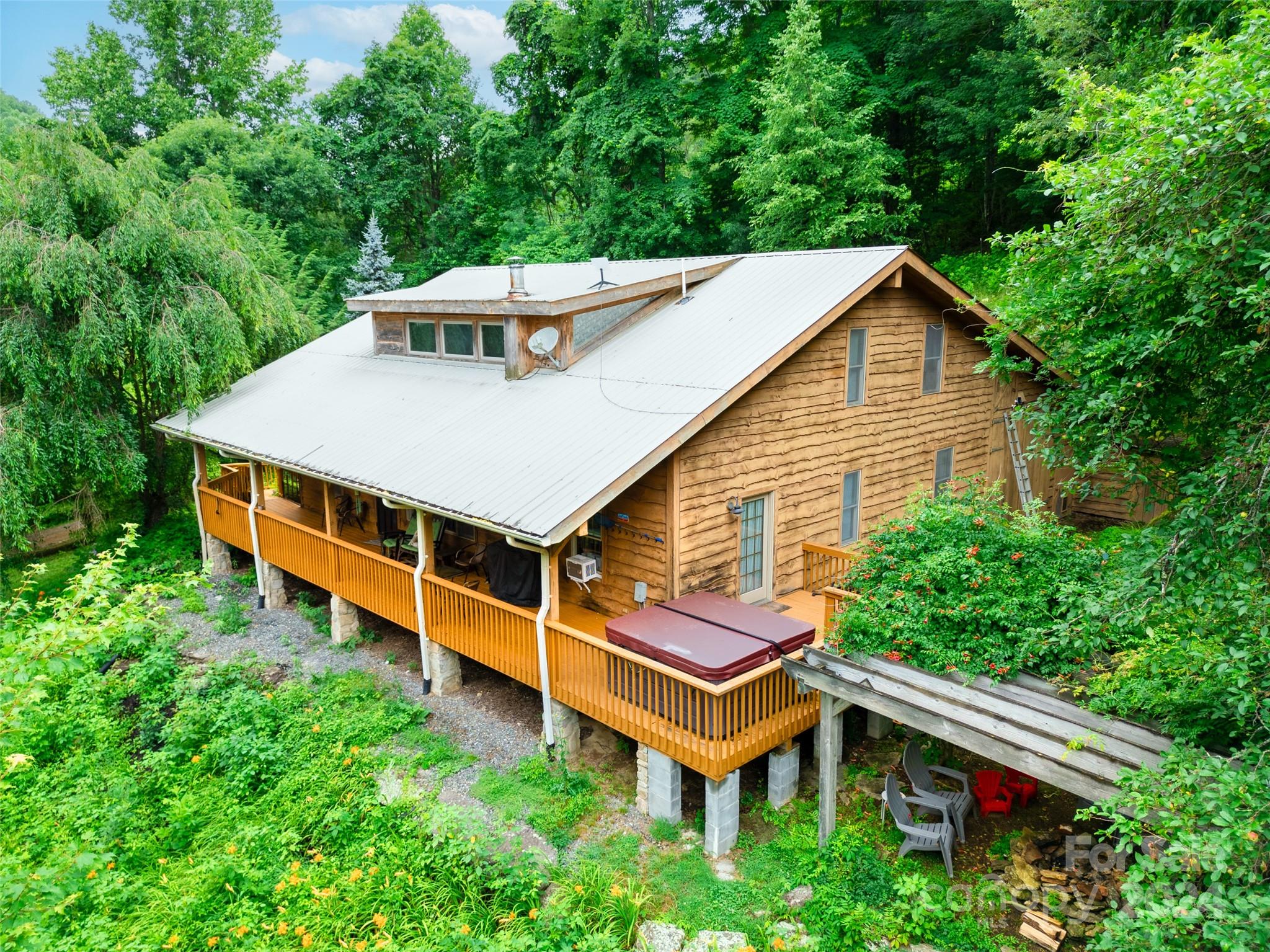 a view of a house with a yard and sitting area