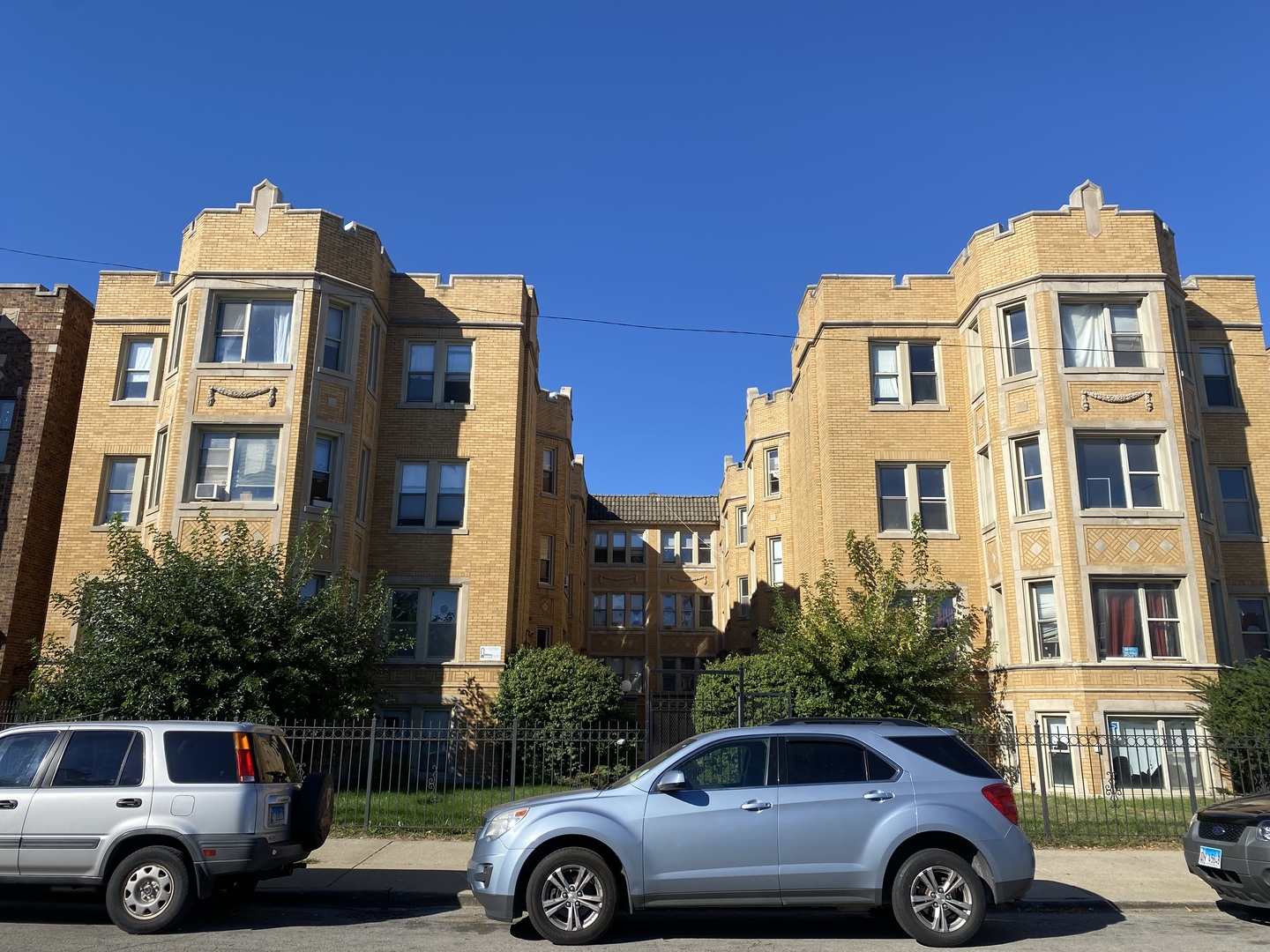 a front view of a house with parking space