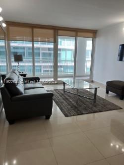 a living room with furniture window and a table