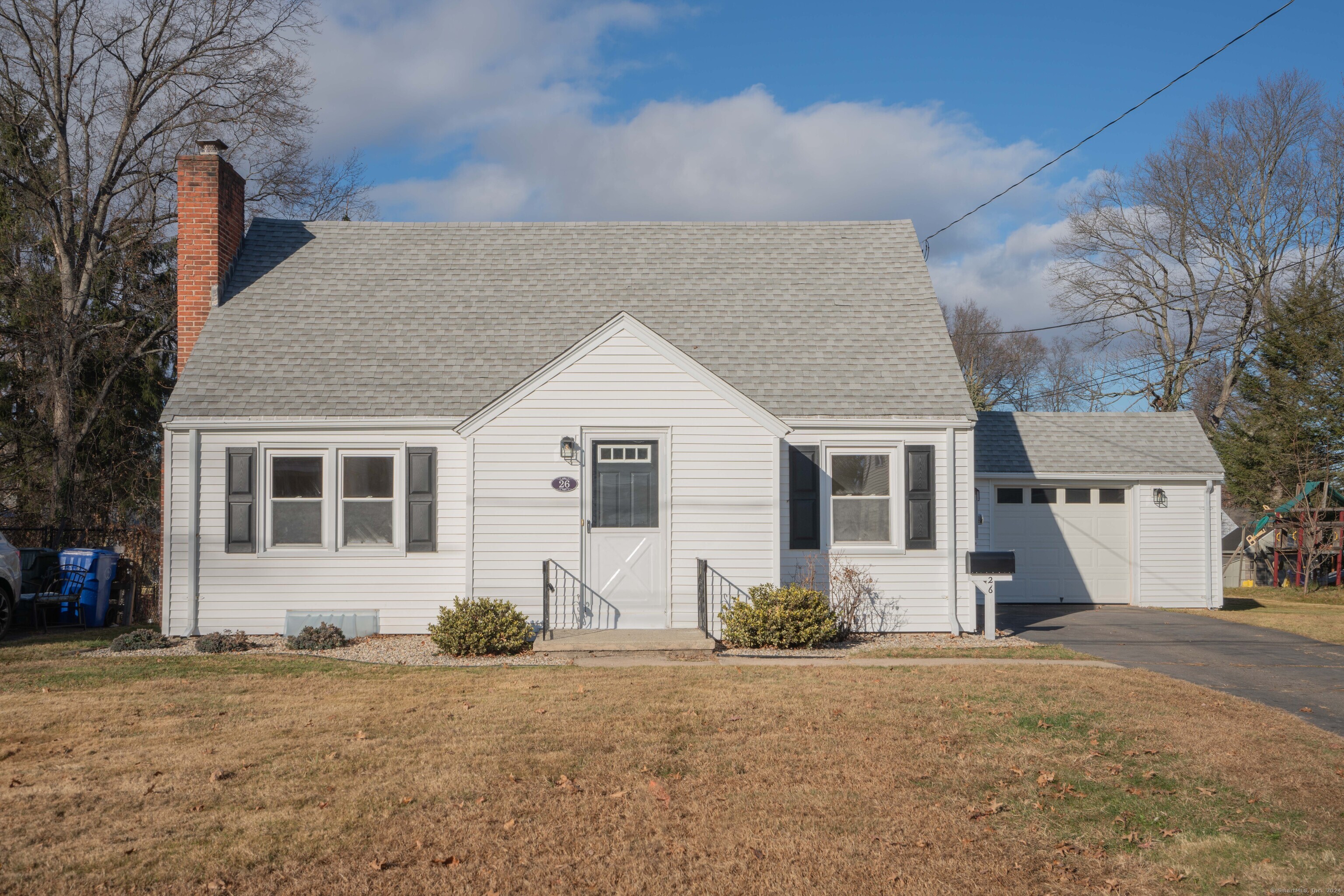 front view of a house with a yard