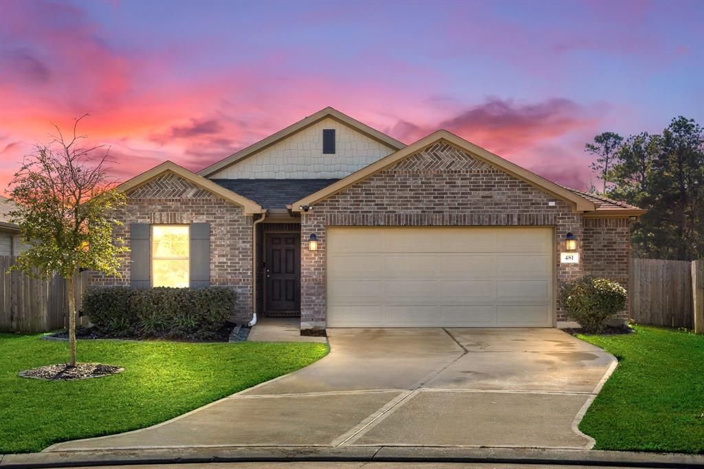 Welcome home to 481 Camas Creek Ln. located on a quiet street in Magnolia Ridge Forest and zoned to Magnolia ISD! This stunning home has lovely curb appeal, a well-manicured lawn, beautiful landscaping, stone/brick elevation, dark stained front door traditional style, and a double wide driveway!