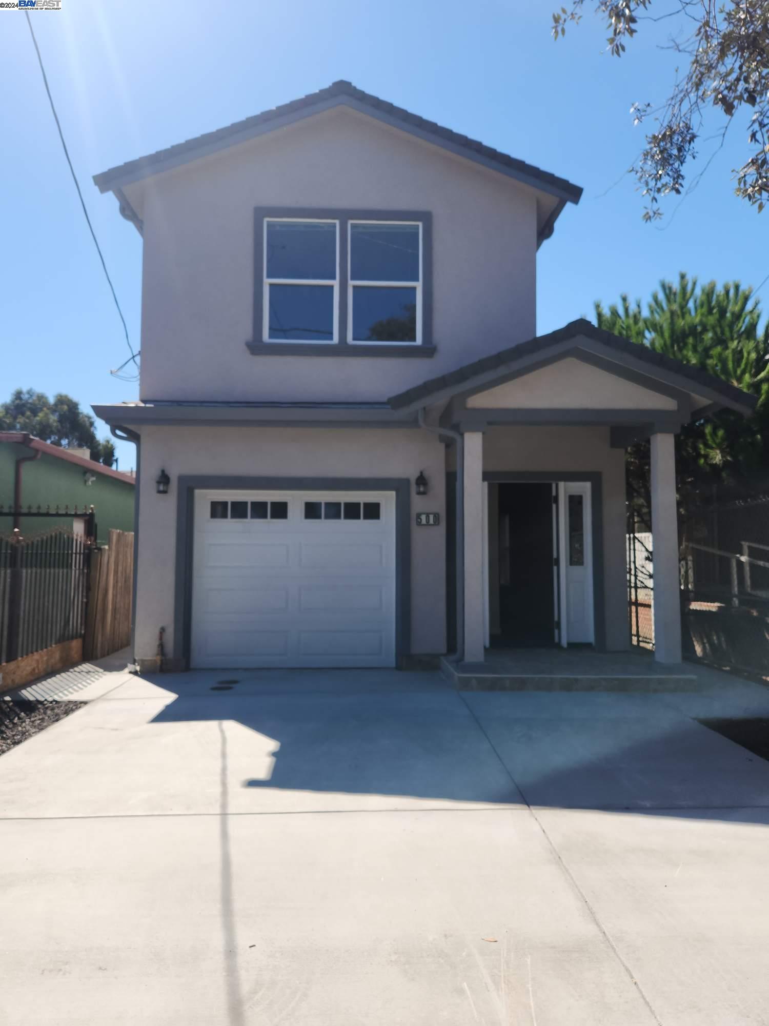 a front view of a house with a garage