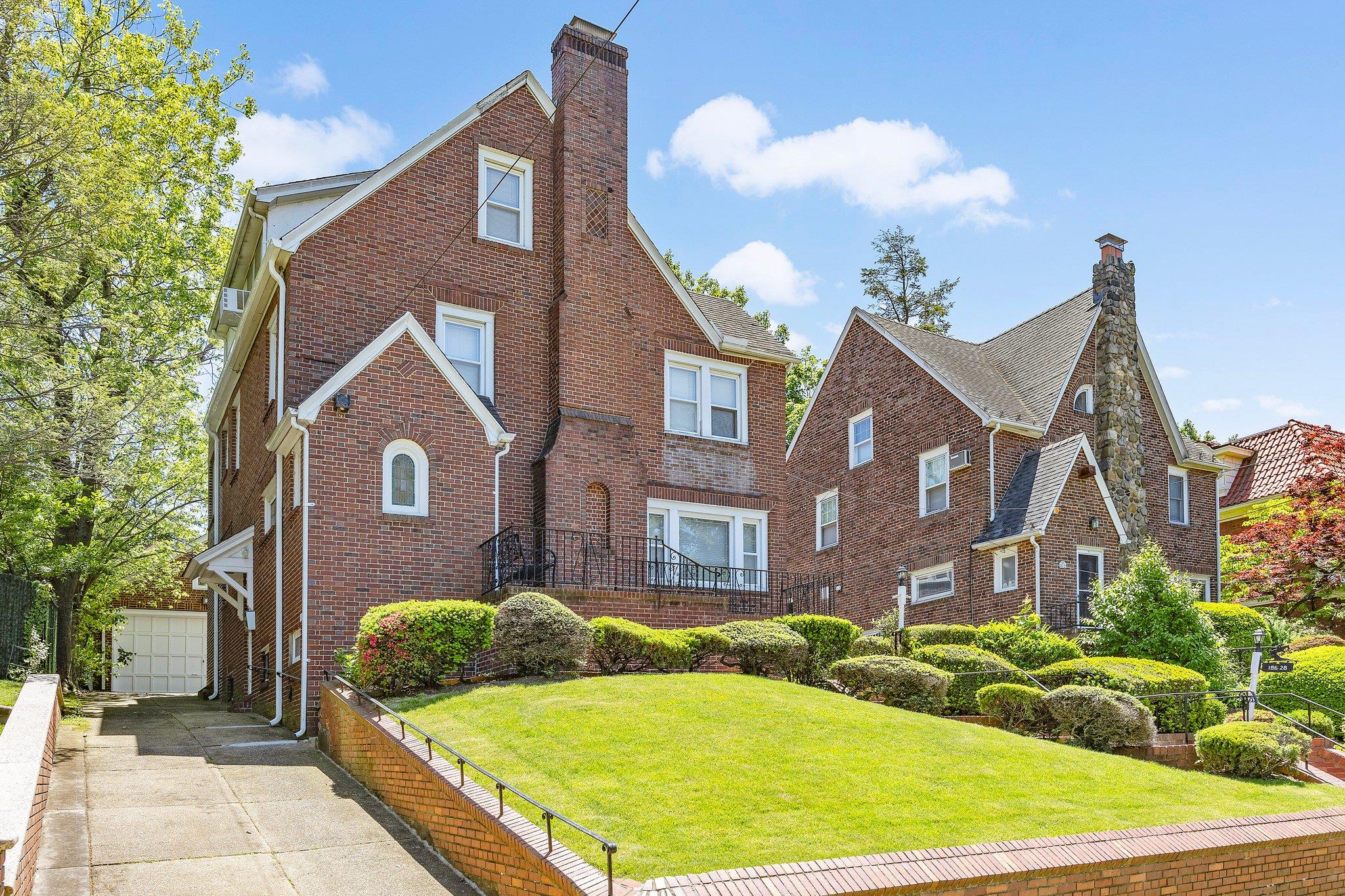 View of front of house featuring a front yard and a garage