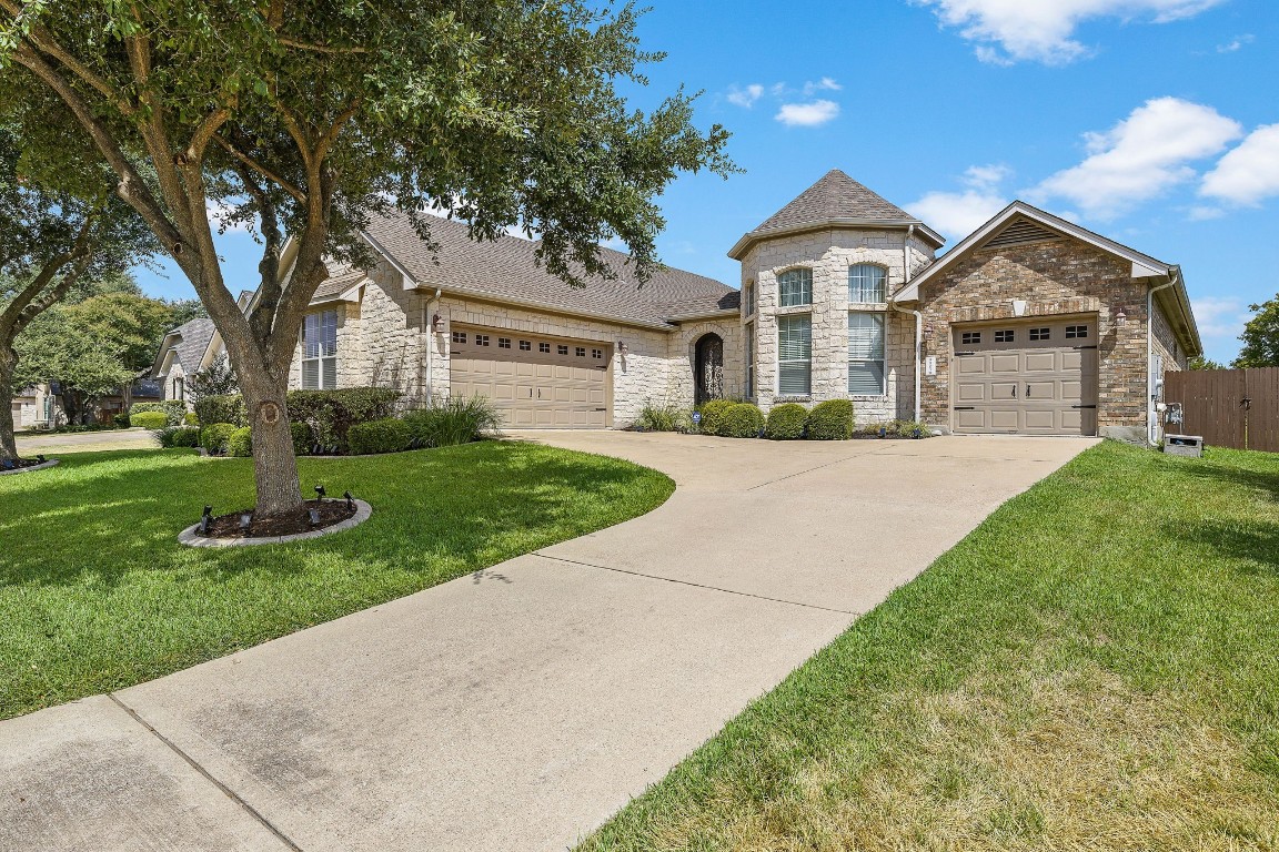 a front view of a house with yard