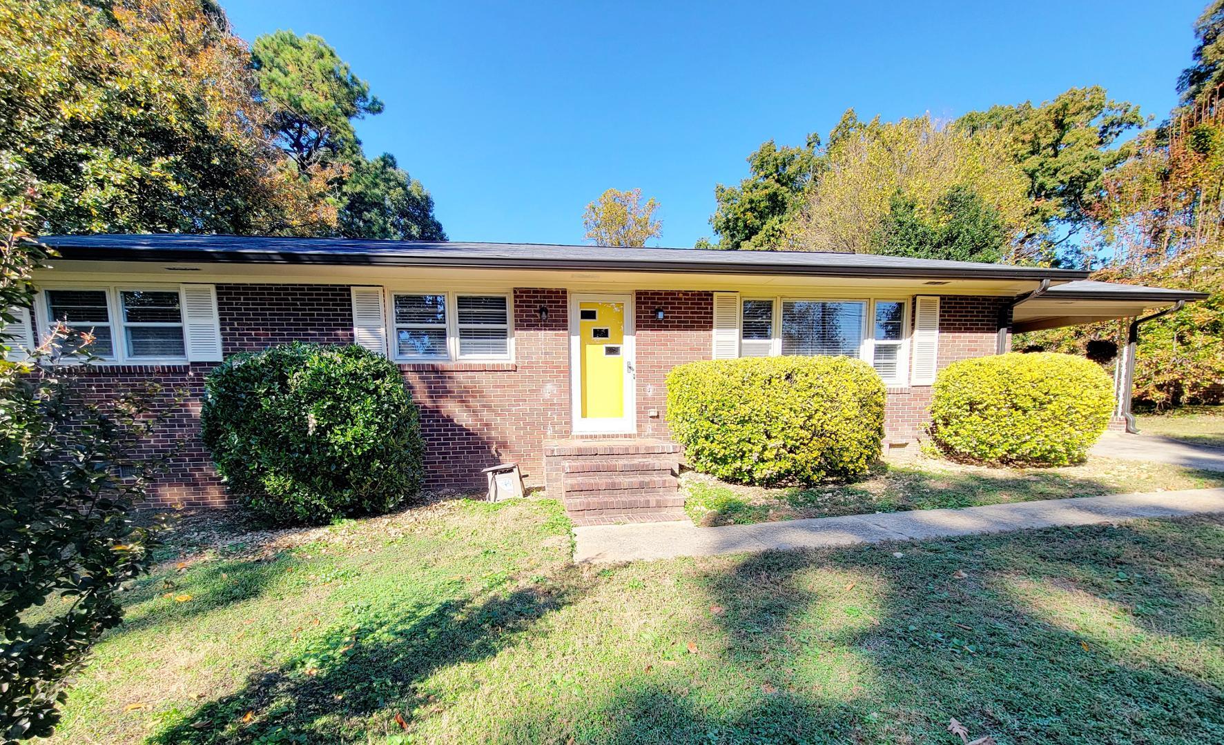 front view of a house with a yard