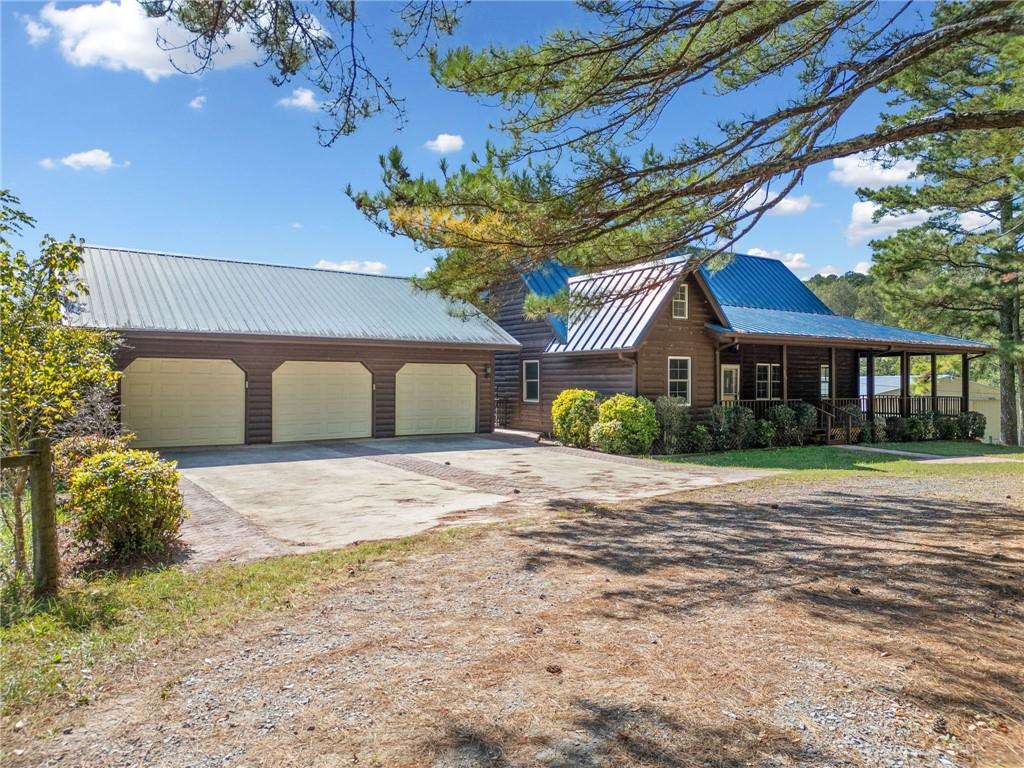 a front view of a house with a yard and a garage