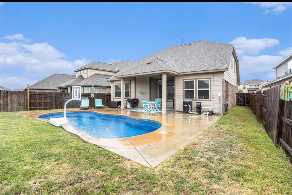 a view of a house with swimming pool and porch