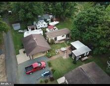 an aerial view of a house with outdoor space