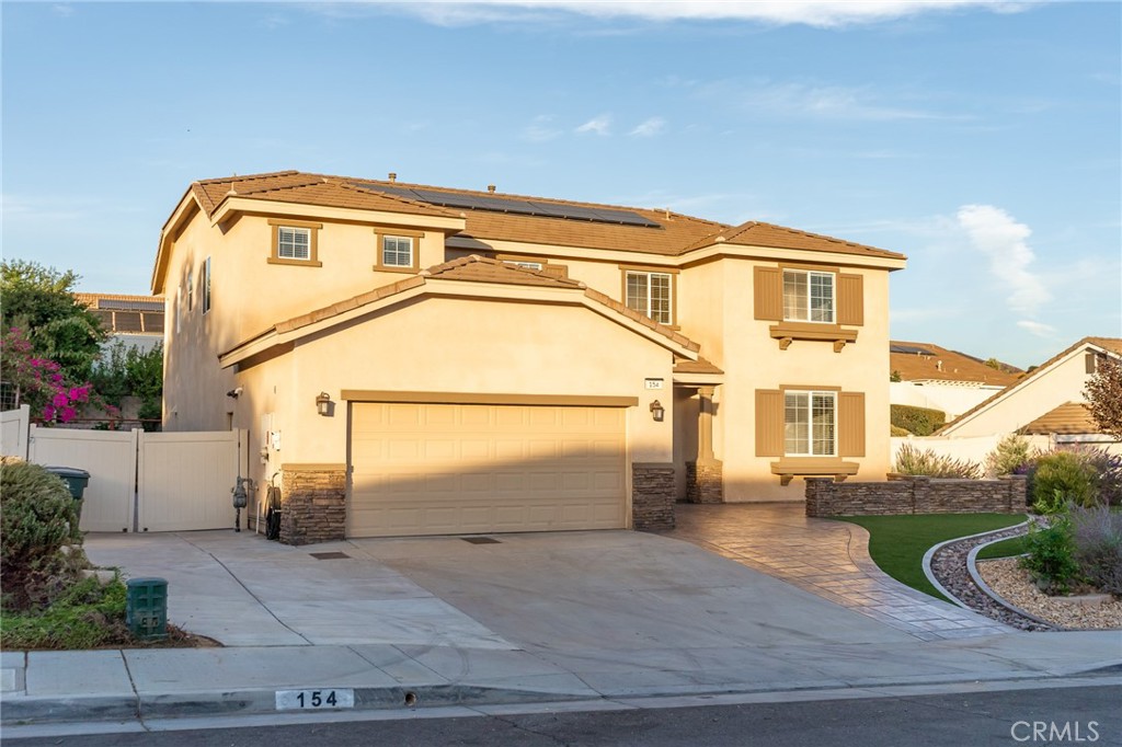 a front view of a house with a garage