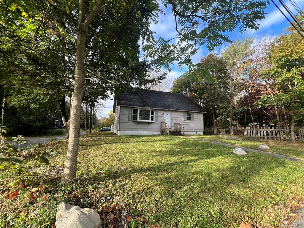 View of front of property with a front yard