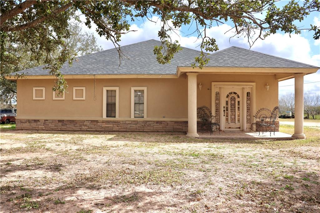 Rear view of house with a patio area