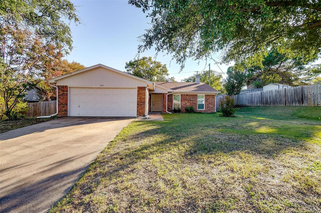 Ranch-style home with a front yard and a garage