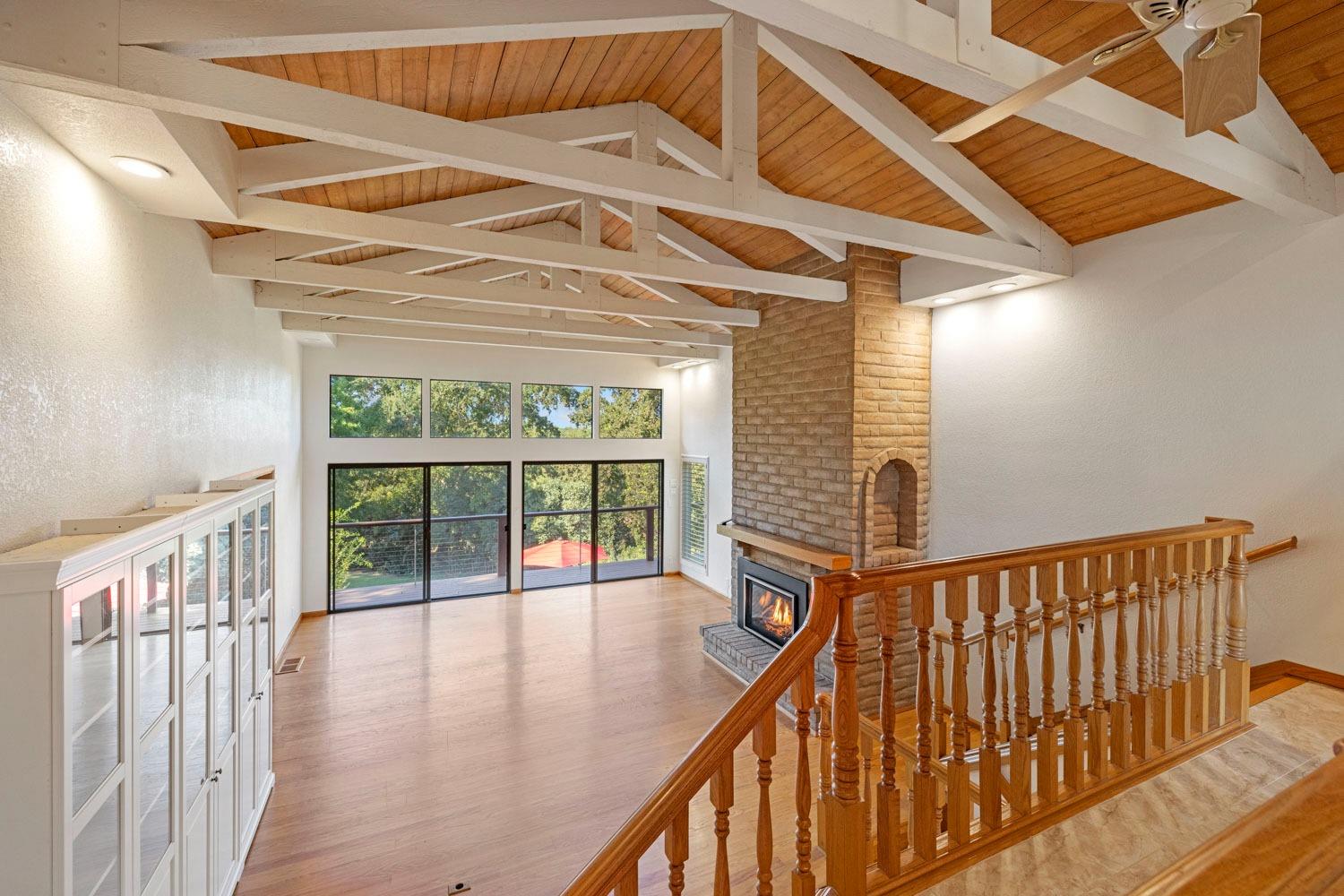 a view of balcony with wooden floor