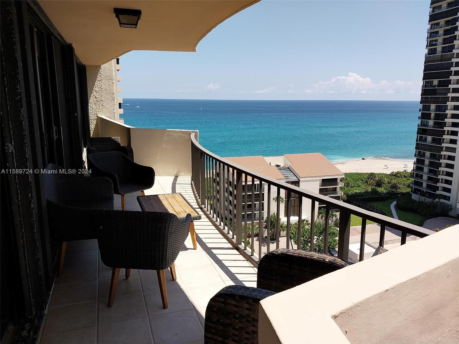 a view of balcony with furniture