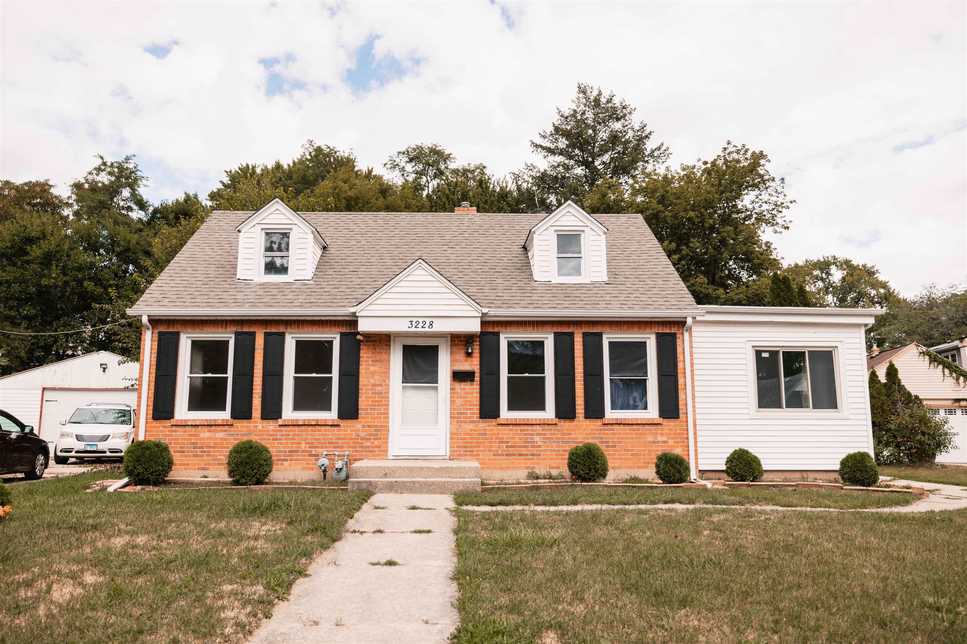 front view of a house with a yard