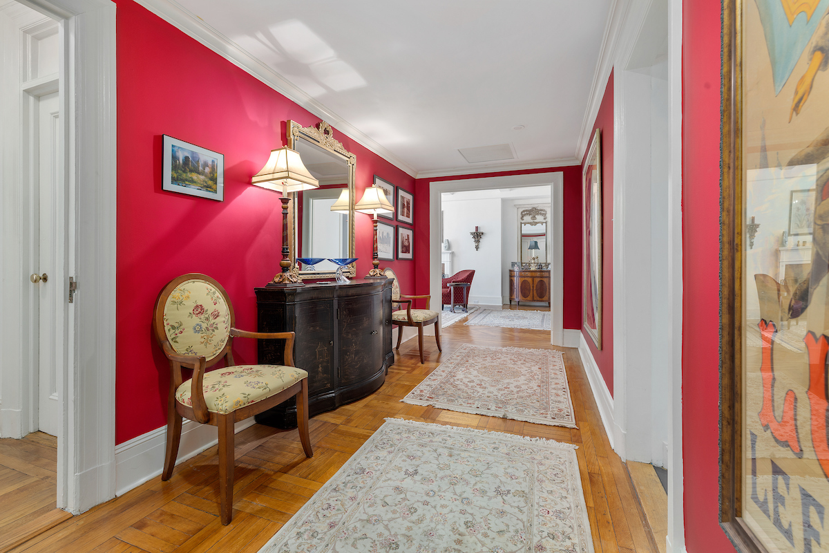 a view of a hallway with chairs