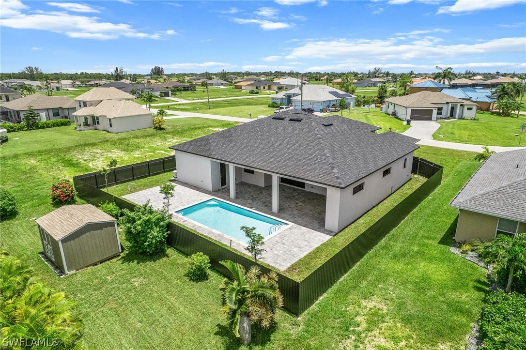 an aerial view of a house with big yard