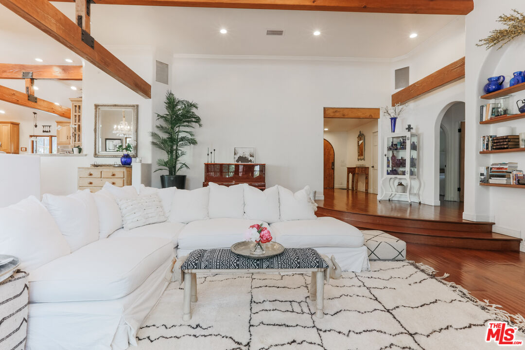 a living room with furniture and a table