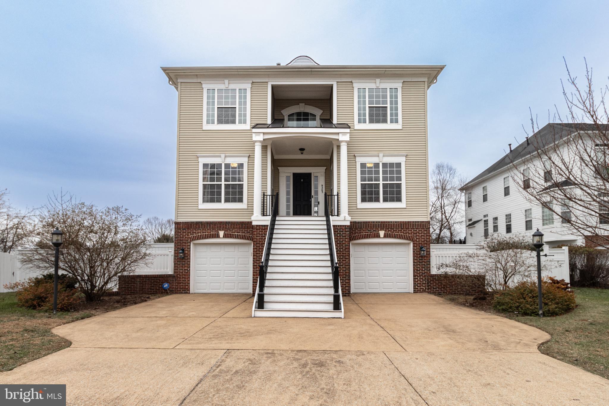 a front view of a house with a garage