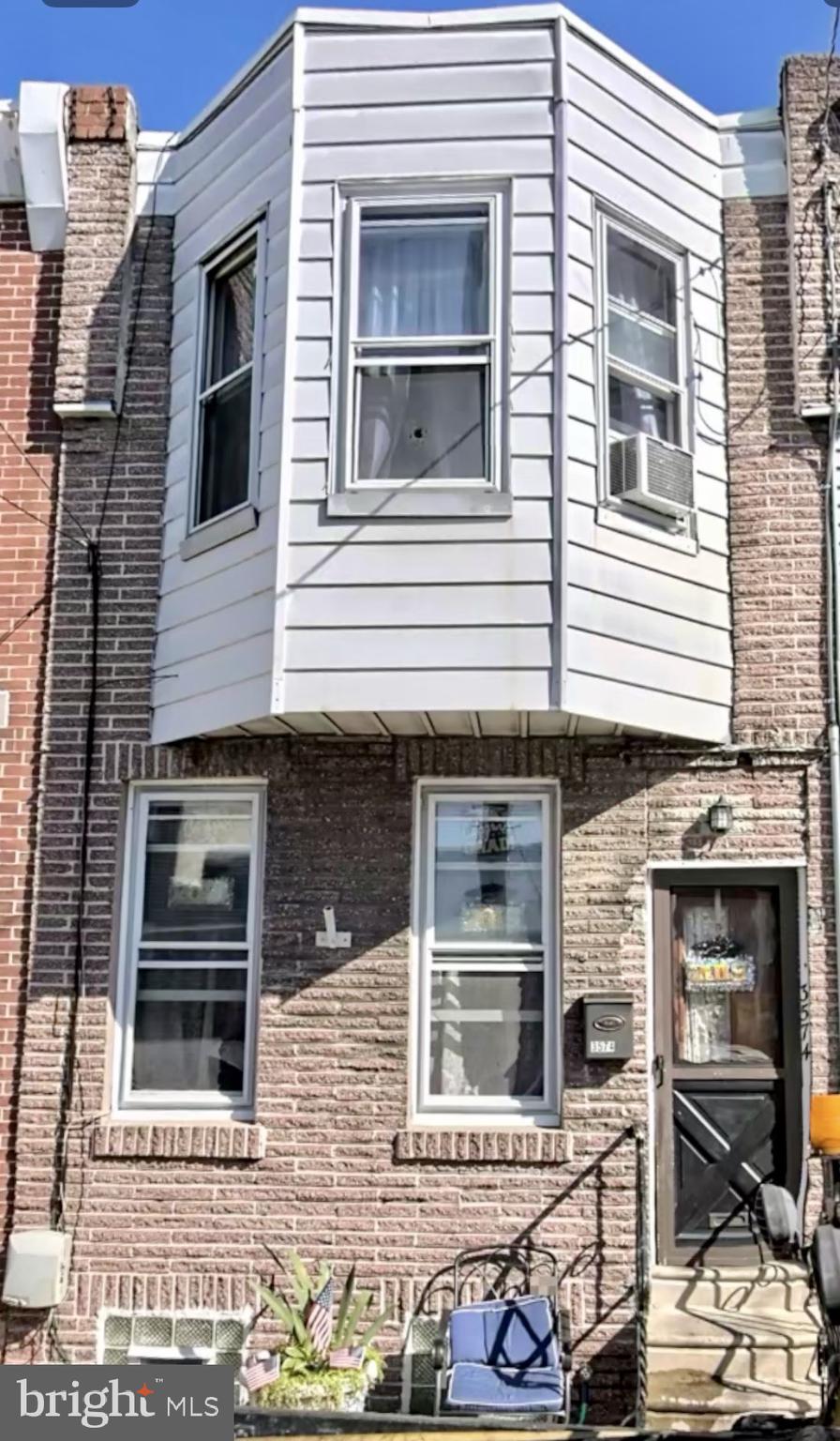 a view of a house with a door and a windows