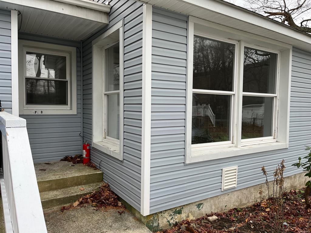 a view of a house with a window and a door