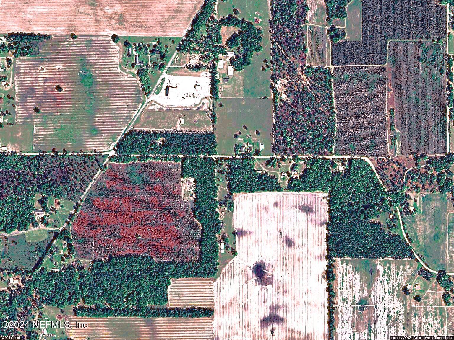 an aerial view of multiple houses with yard