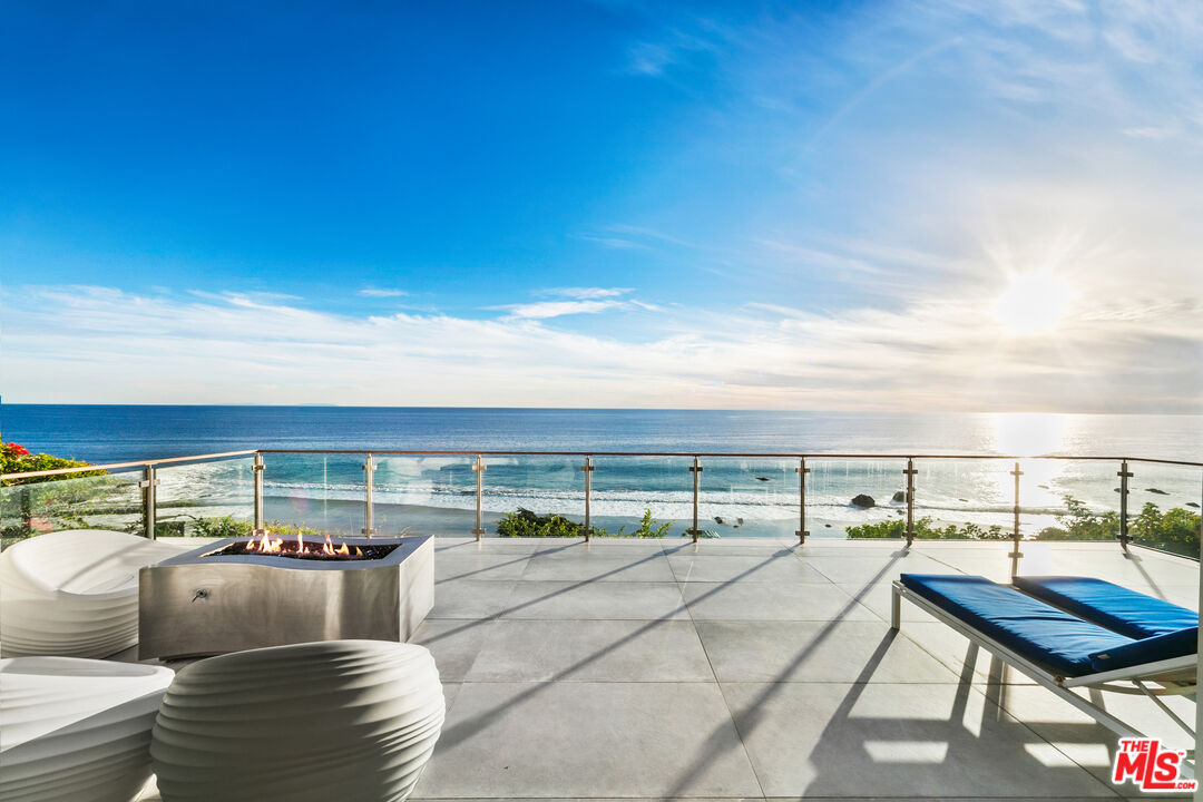 a balcony with furniture and city view