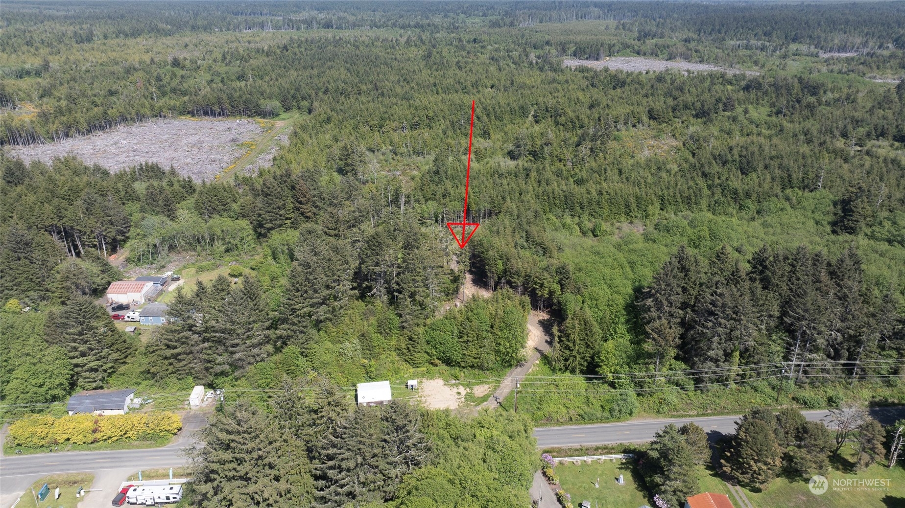 an aerial view of a houses with yard