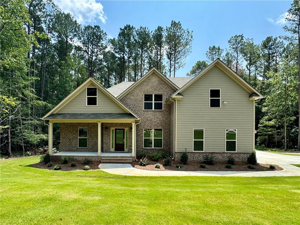 a front view of a house with a yard