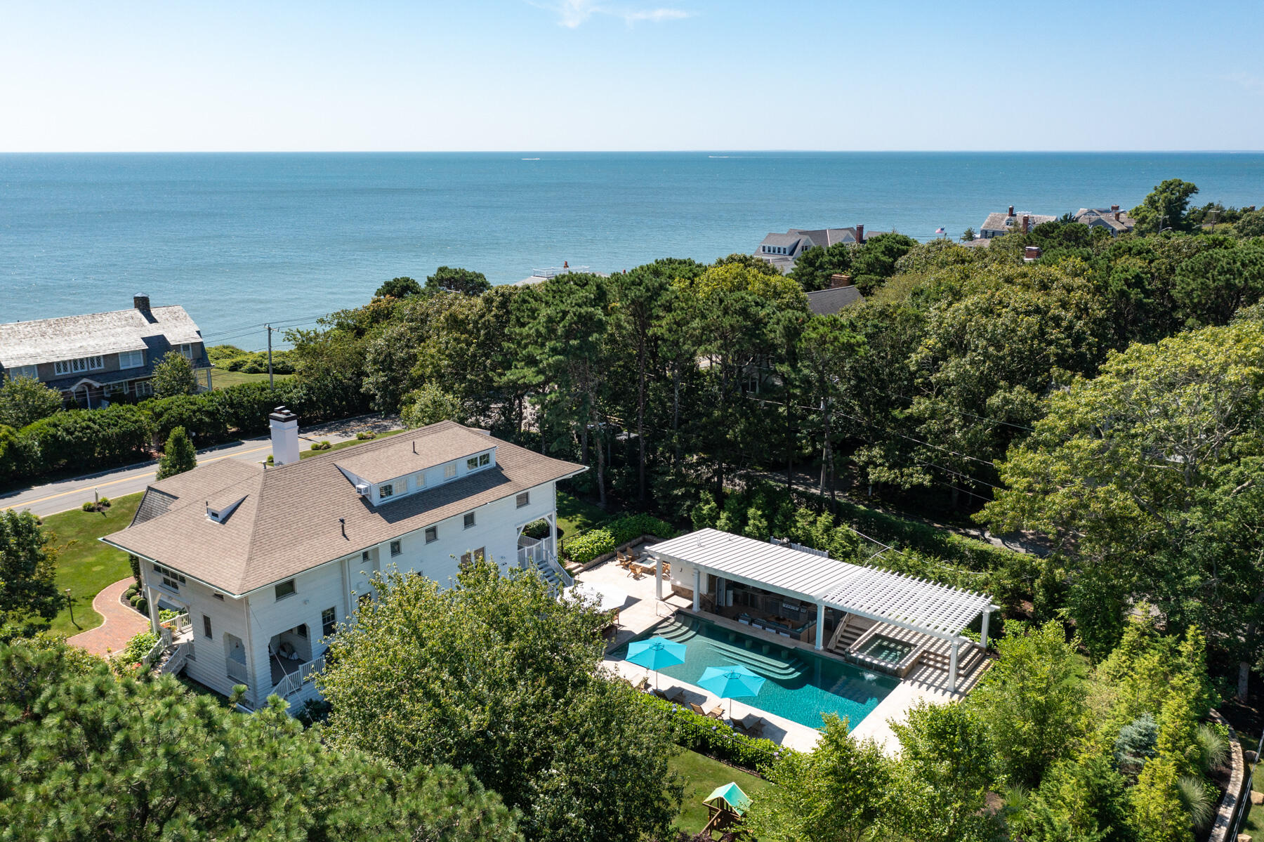 an aerial view of a house with ocean view