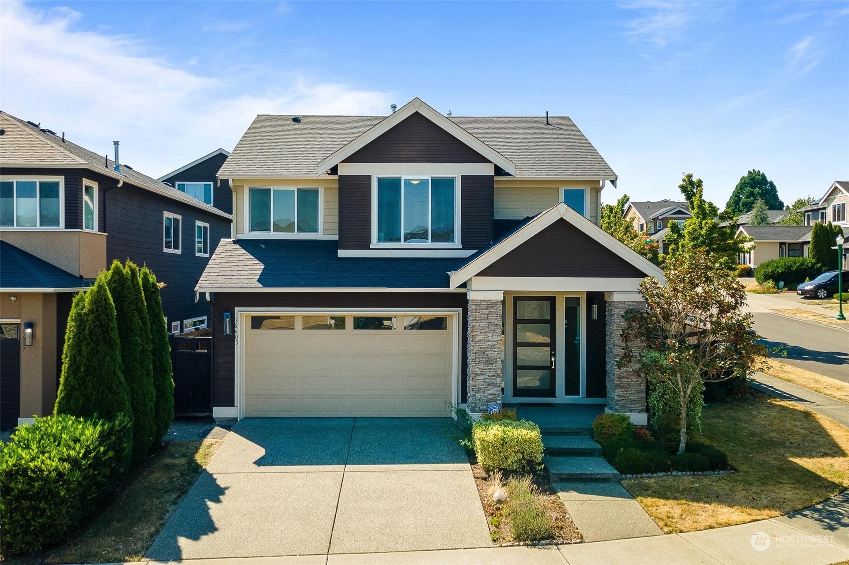 a front view of a house with garden