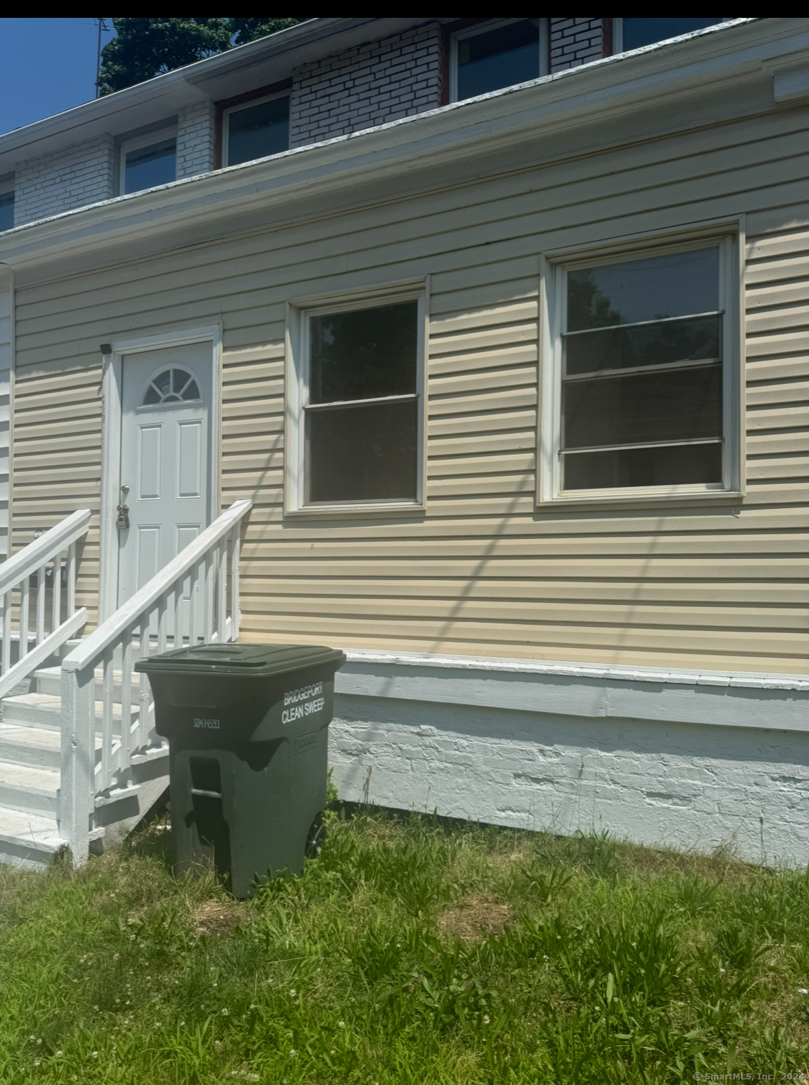 a balcony with table and chairs