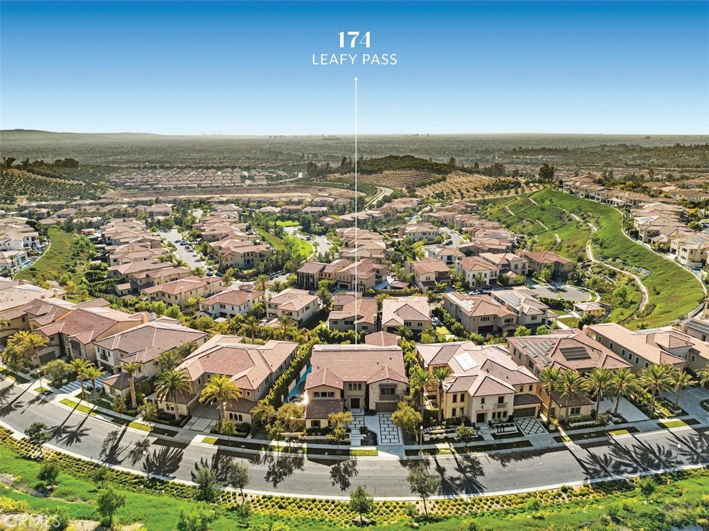 an aerial view of residential building with parking