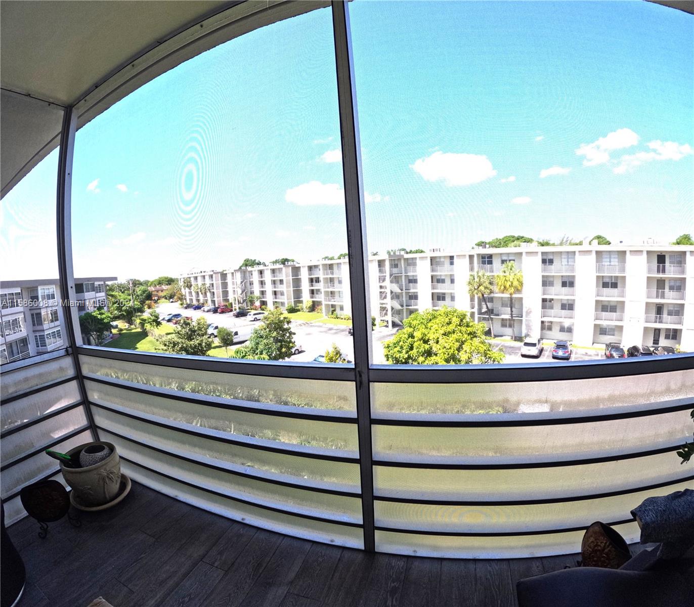 a view of balcony with furniture