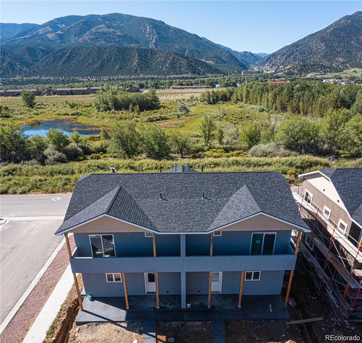 a aerial view of a house with a yard