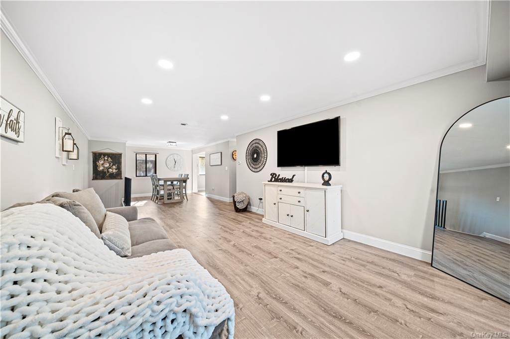 a bedroom with furniture and flat screen tv