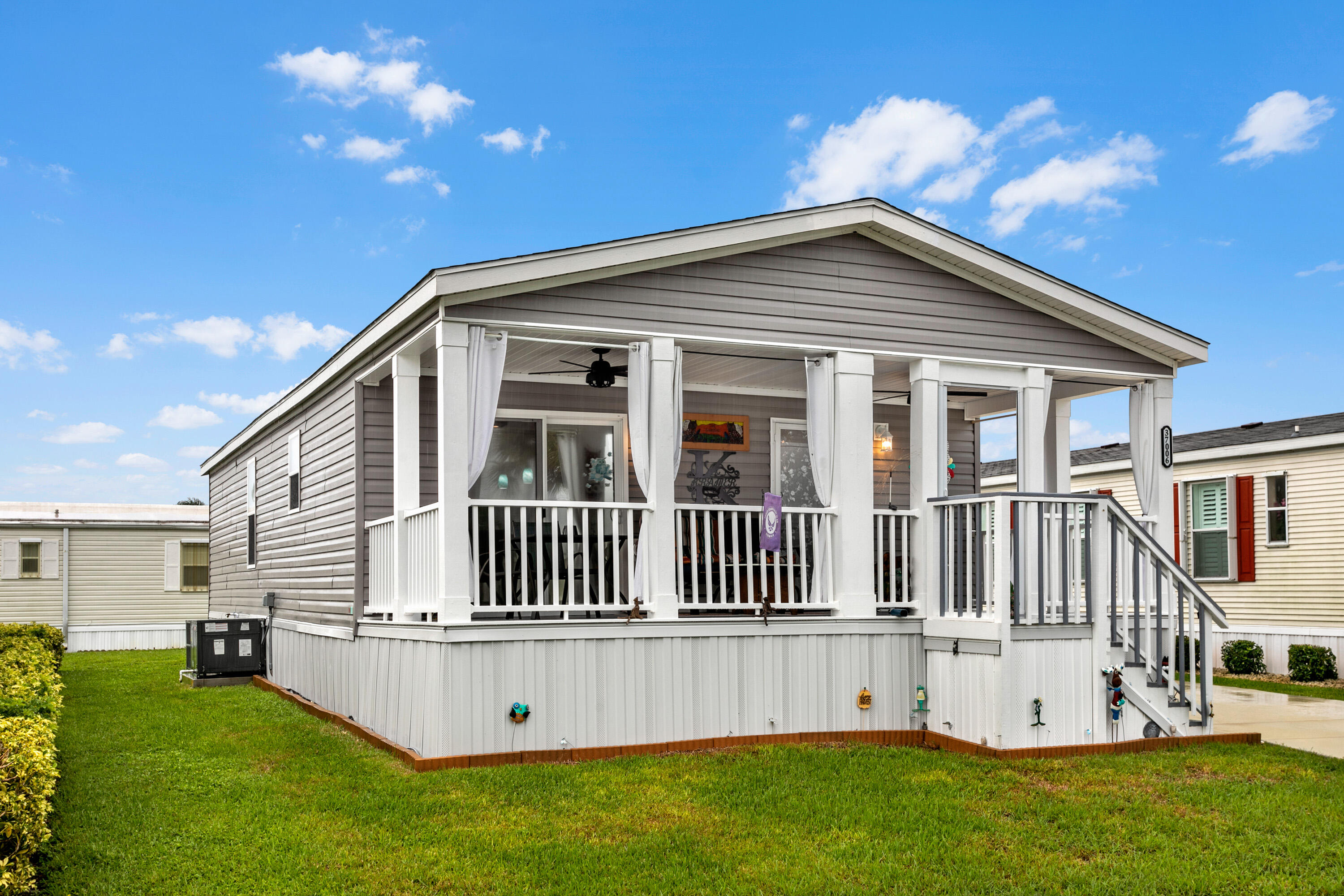 a view of a house with a yard and deck