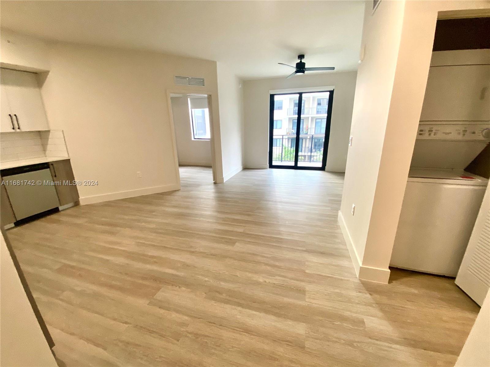 a view of livingroom with furniture and window