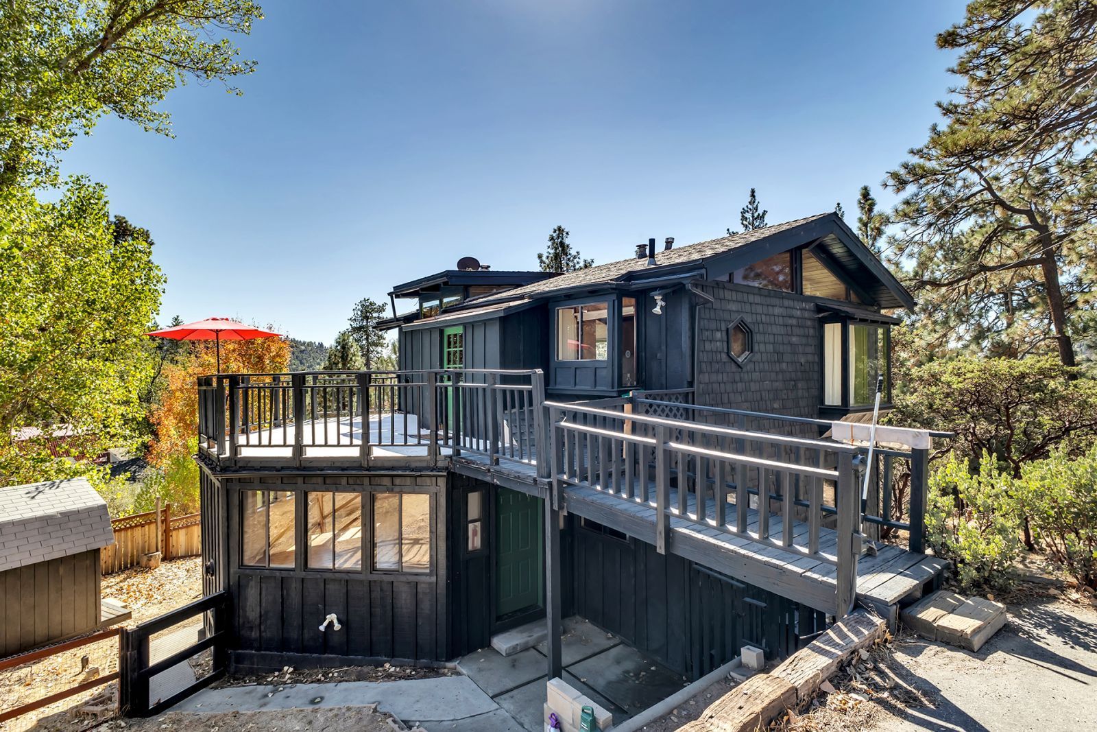 a view of a house with wooden deck