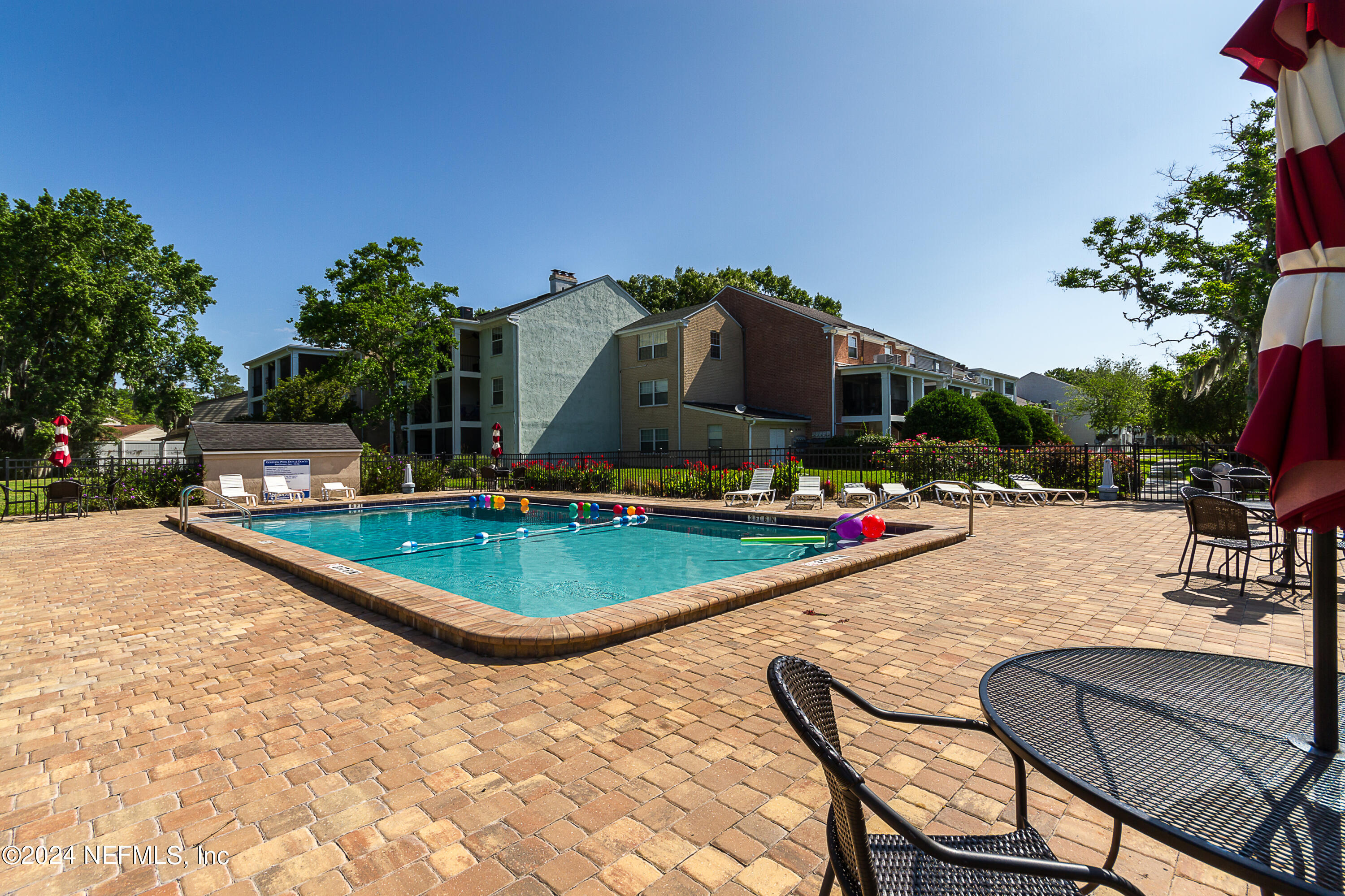 a view of a swimming pool with a lounge chairs