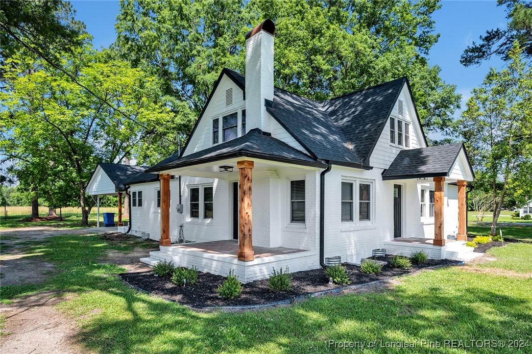 front view of house with a yard