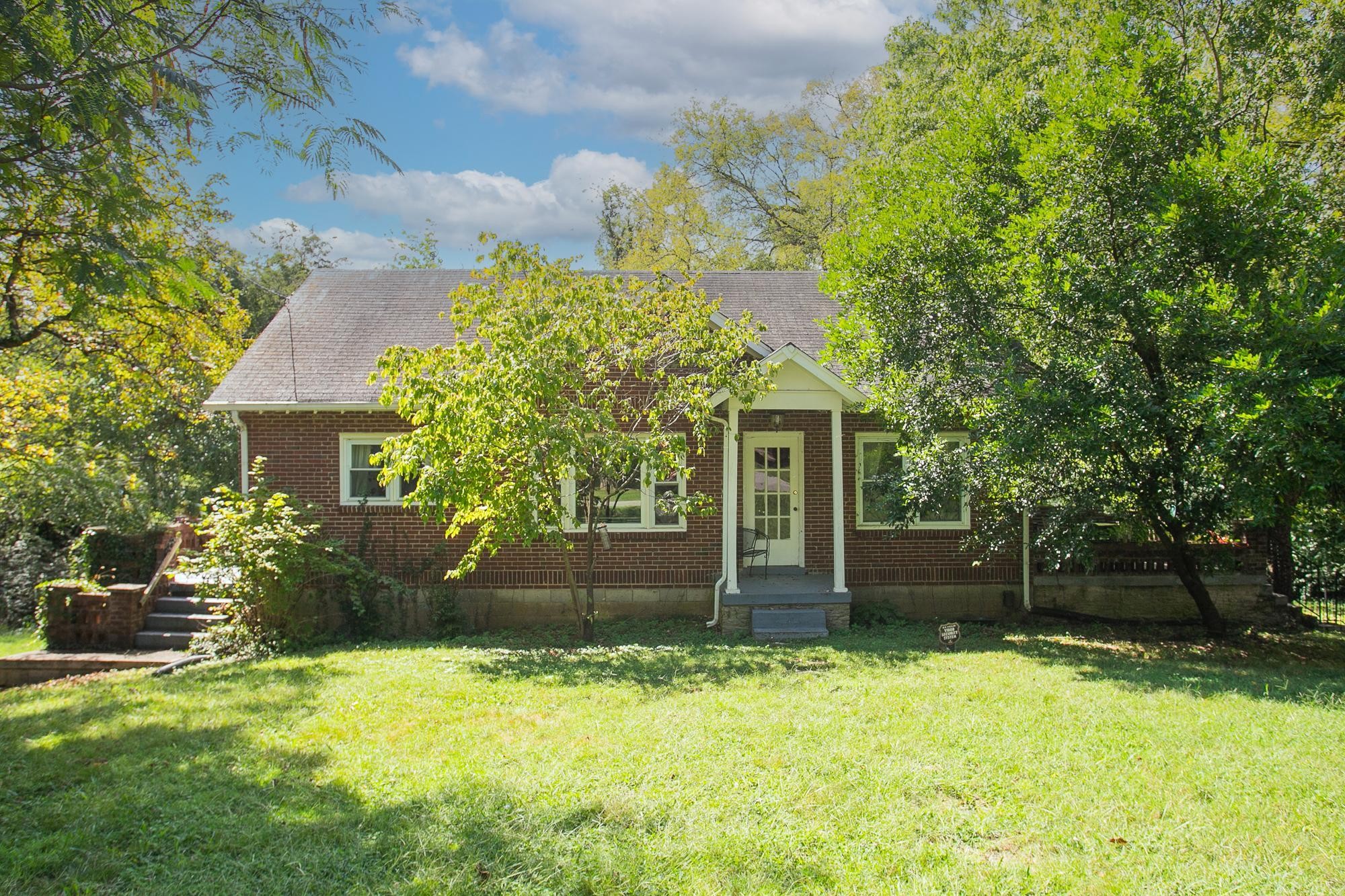 front view of a house with a yard