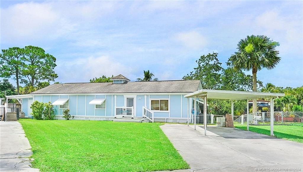 front view of a house with a yard