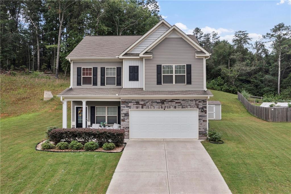 a front view of a house with a yard