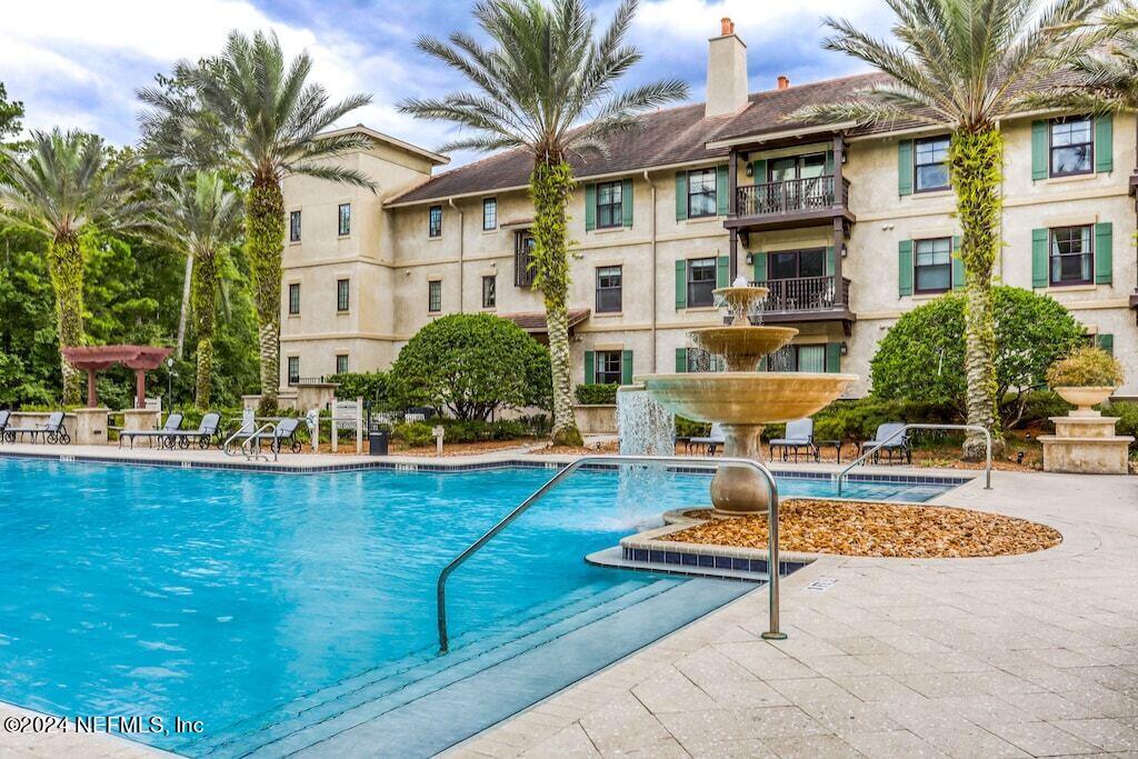 a front view of a building with swimming pool