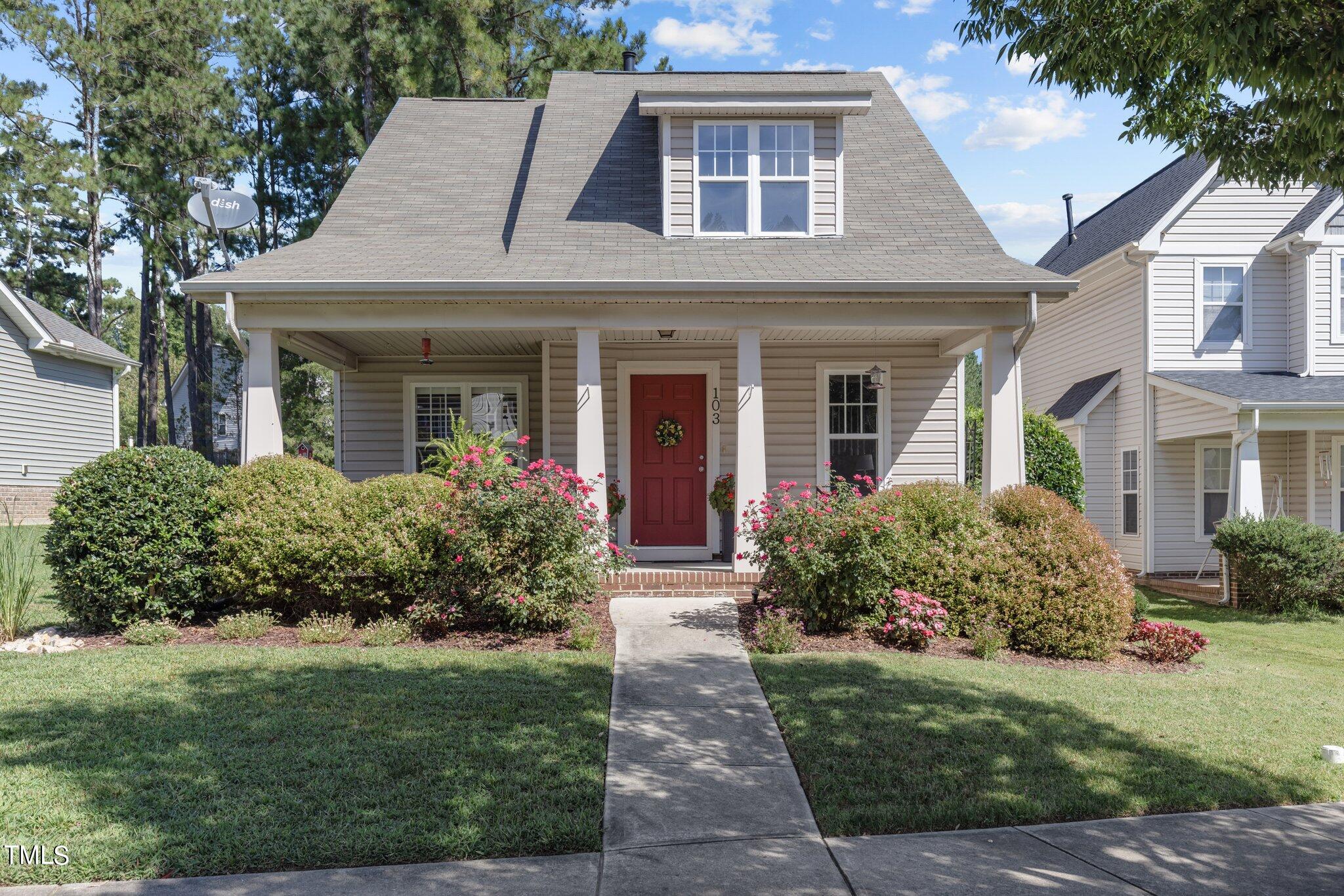 front view of a house with a yard